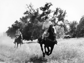 Bobby Darin (foreground), Don Galloway (background), on-set of the western film, "Gunfight In