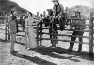 James Darren (left), Kathryn Grant, Bert Convy (sitting on fence), on-set of the western film,