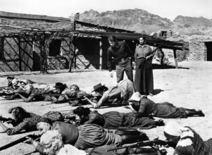 Audie Murphy, Hope Emerson (both standing rear), Peggy Maley (foreground), on-set of the western