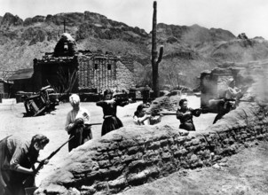 Hope Emerson (left), Peggy Maley (second left), on-set of the western film, "The Guns Of Fort