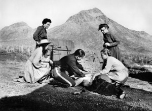 Audie Murphy (on knees, center), on-set of the western film, "The Guns Of Fort Petticoat", Columbia