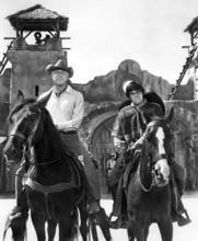 George Kennedy, Reni Santoni, on-set of the western film, "Guns Of The Magnificent Seven", United