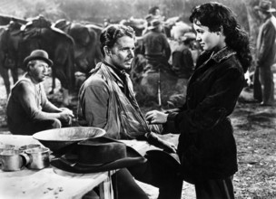 Jesse White (left), Audie Murphy (center), Susan Cabot (right), on-set of the western film,