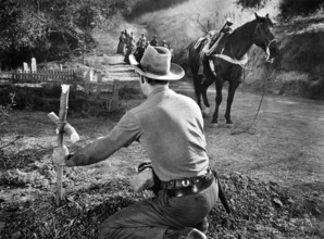 Jock Mahoney, on-set of the western film, "Joe Dakota", Universal Pictures, 1957