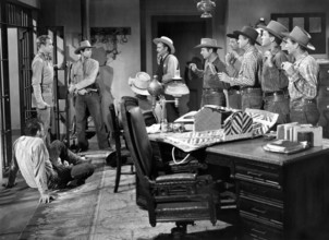 Rex Allen (standing left), Michael Hall (standing 2nd left),  Stan Jones (sheriff), on-set of the