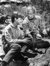 Tommy Rettig, Richard Widmark, on-set of the western film, "The Last Wagon", 20th Century-Fox, 1956