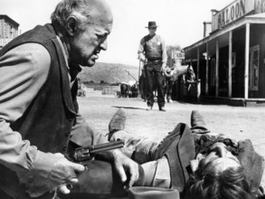 Lee J. Cobb (kneeling left), Burt Lancaster (standing center), on-set of the western film,