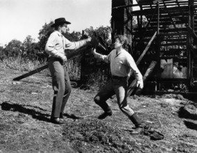 Michael Landon (right), Jack Hogan (left), on-set of the western film, "The Legend Of Tom Dooley",