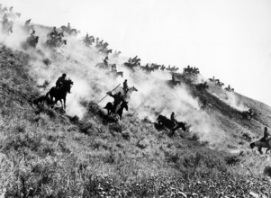 Native American fighters charging down hillside on horseback, on-set of the western  film, "Little