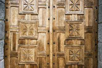 Close-up view of Intricately carved wood doors