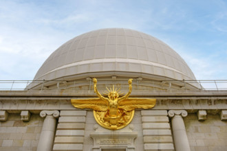 Low angle view of main entrance with bronze statue of Greek God Apollo and dome, Nice Observatory,