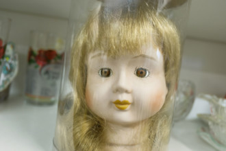 Doll head for sale on display in antique store