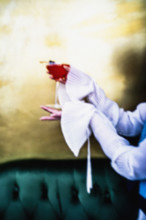 Woman holding a pink cocktail in martini glass