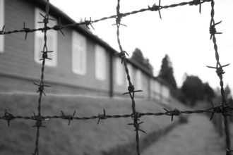 Barbed wire and building exterior, Natzweiler-Struthof Nazi concentration camp, Natzwiller,