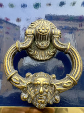 Brass door knocker on blue lacquer door