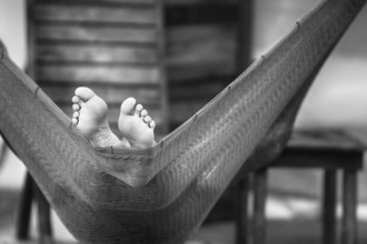 Two bare feet in hammock