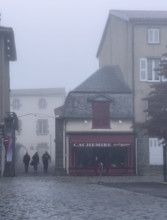 Street scene on foggy morning, Saint-Flour, France