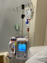 IV pump and drip apparatus in hospital room