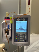 IV pump and drip apparatus in hospital room