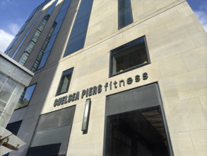 Chelsea Piers Fitness, low angle view of building exterior and company sign, New York City, New