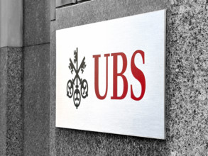 UBS Group AB, close-up of office building exterior with company logo and sign, New York City, New