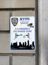 NYPD Station E-Commerce Exchange Zone, close-up of sign on building exterior, 10th Precinct, New