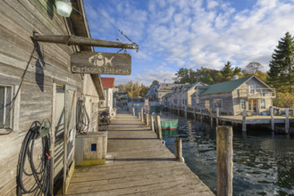 Carlson's fisheries and other dockside structures along Leland River, Leland, Michigan, USA