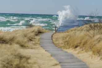 Waves crashing on dock, Lake Michigan, Frankfort, Michigan, USA