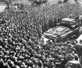 U.S. Lieutenant Colonel Woran, Chaplain of the 10th Mountain Division, leading group of men in