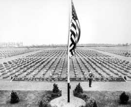 American bugler blowing taps at close of Memorial Day service at Margraten Cemetery, Holland, where
