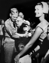 Repatriated Prisoner of War Captain, Frederick Smith is greeted by his father on his arrival on