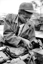 Private Lawanna Simpson, auto mechanic, 724th Maintenance Battalion, working on U.S. Army 5-ton