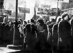 Beggars marching in protest scene, on-set of the German musical film, "The Threepenny Opera",