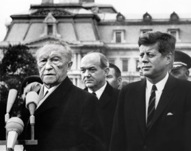U.S. President John F. Kennedy looking on as Chancellor of West Germany, Dr. Konrad Adenauer,