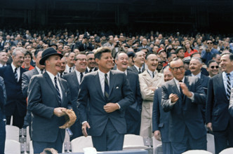 U.S. President John F. Kennedy (laughing), California Governor Edmund "Pat" Brown, (clapping,