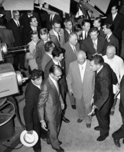 Soviet Premier Nikita Khrushchev and U.S. Vice President Richard M. Nixon pause in front of color