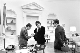 U.S. President Richard Nixon meeting with Elvis Presley during open hour in the Oval Office with