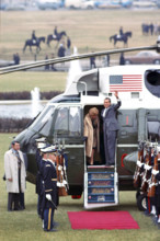 U.S. President Richard M. Nixon and U.S. First Lady Pat Nixon wave from helicopter door as they