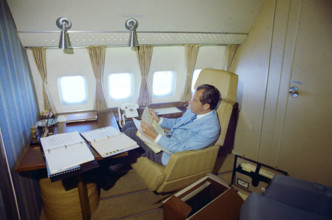 U.S. President Richard M. Nixon seated on board Air Force One inside a private cabin enroute to