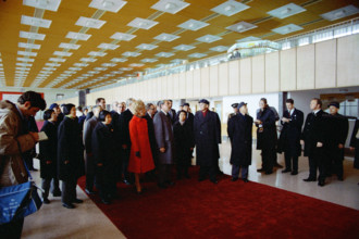 U.S. President Richard M. Nixon and U.S. First Lady Pat Nixon walk with Chinese Delegation into an