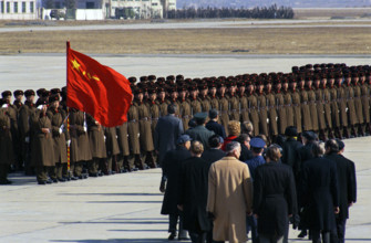 U.S. President Richard M. Nixon and Chinese Premier Chou En-Lai viewing Chinese Honor Guard during