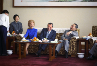 U.S. President Richard M. Nixon and U.S. First Lady Pat Nixon have Tea and Laugh while seated with