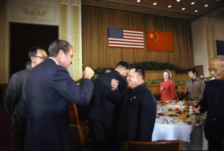 U.S. President Richard M. Nixon Sharing a Toast with a Chinese Official during a formal banquet in