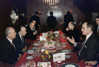 U.S. President George H.W. Bush having lunch with Soviet General Secretary Mikhail Gorbachev aboard