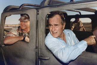 U.S. President George H.W. Bush riding in HUMVEE with U.S. General H. Norman Schwarzkopf during his