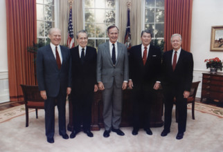 U.S. President George H.W. Bush participating in group photo with former U.S. Presidents Gerald