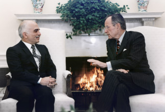 U.S. President George H.W. Bush meeting with King Hussein of Jordan in the Oval Office, White