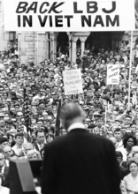 U.S. President Lyndon B. Johnson speaking to large crowd, which included remarks defending his