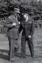 French General Charles de Gaulle, left, chatting with U.S. General Dwight D. Eisenhower during