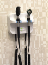Veterinary medical instruments hanging on wall in exam room wall